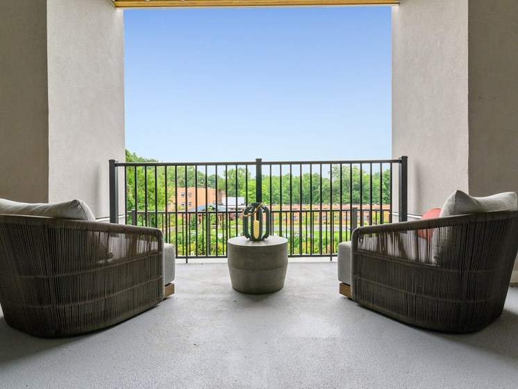 Arm chairs overlooking Wynnewood, PA on spacious balcony at 30 Lancaster